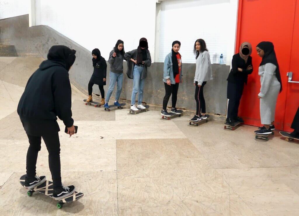 A group of women engaging in sports activities - skating A group of women engaging in sports activities - skating